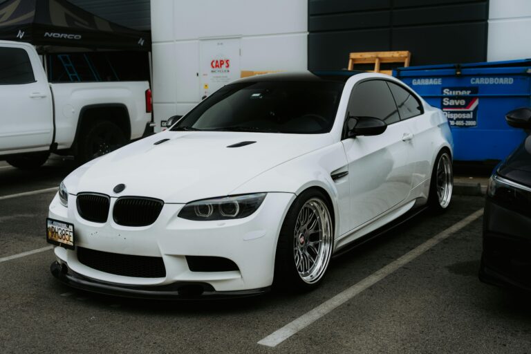 White sports car with auto ceramic window tint parked.
